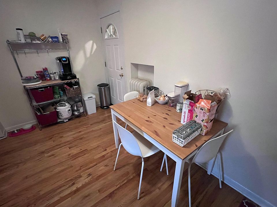 Eat-in kitchen, baker's rack and door to back steps