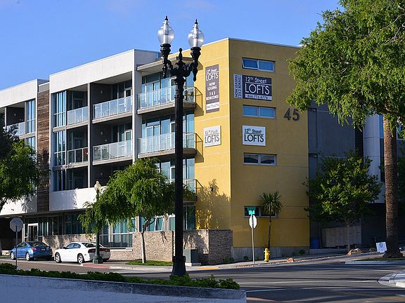Corner street view of 12th Street Lofts in National City, California.