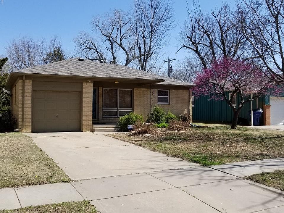 Located in a quaint neighborhood with mid century ranch home