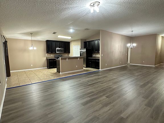 fresh LVP flooring, (blue tape only temporary and will be removed)