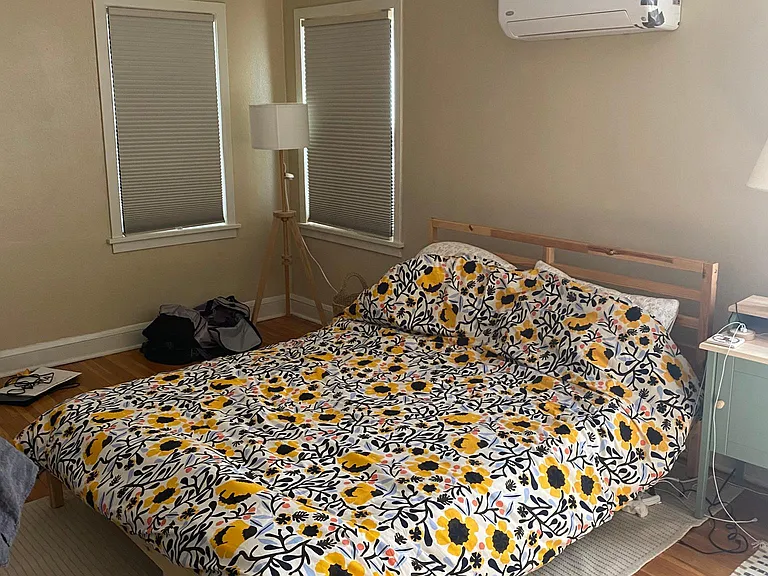 Larger Bedroom with AC visible.