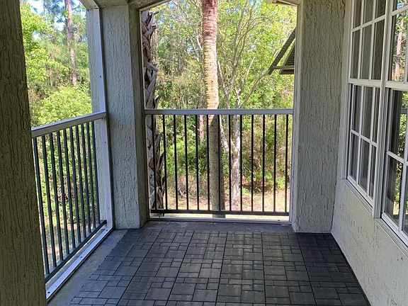 Private covered balcony, facing a lake view. This area is secluded from neighbors.