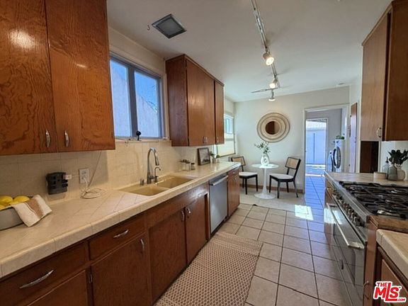 4th image of 12207 Palms Blvd