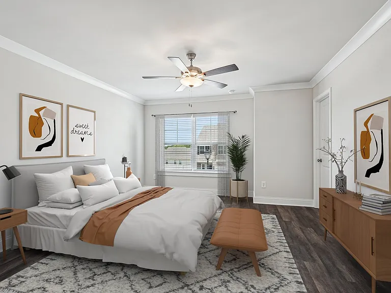 Primary Bedroom with king size bed and large window letting in nice natural light.