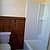 Bathroom full tub/shower, ceramic tile floor, original wains