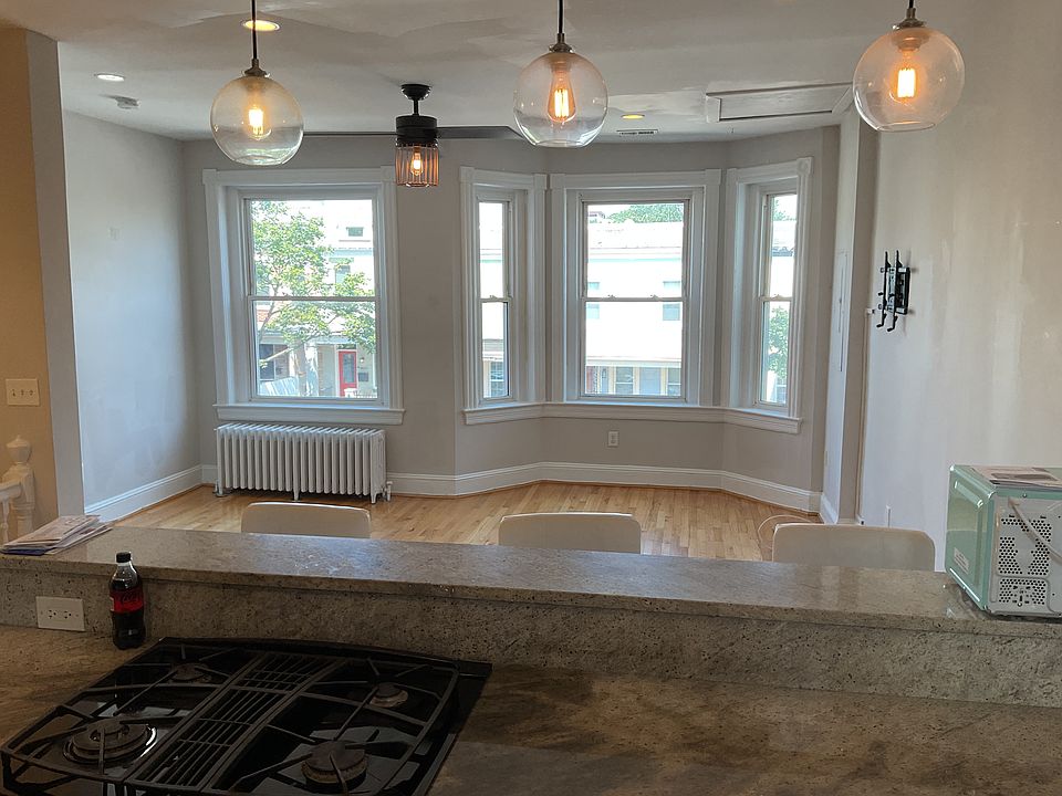 View from kitchen into sunny living room.