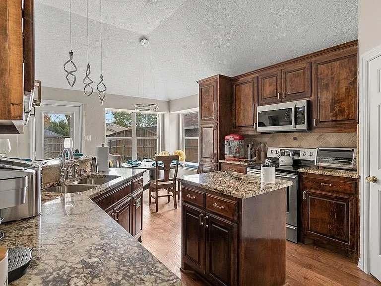 Kitchen: the door to the right is a spacious walk-in pantry.