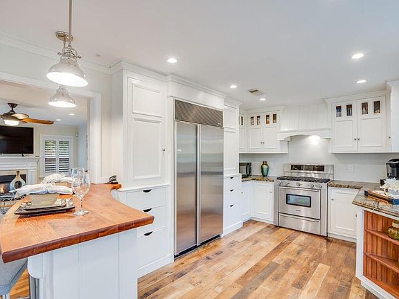 Kitchen with large Subzero fridge and gas range