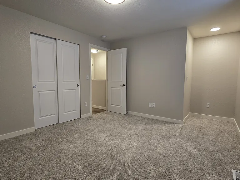Upstairs bedroom #1 - large space with closet. Check out the cute nook with light and window seat.