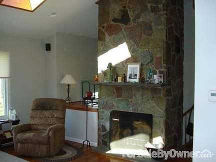 LIVING ROOM FIRE PLACE...14 FEET
						:
						HAND MADE-VANTASSEL GRANITE WITH BLUE STONE HEARTH AND MANTEL.