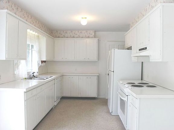 Nice bright kitchen features newer appliances and lots of counterspace, cabinets, and a huge pantry closet!