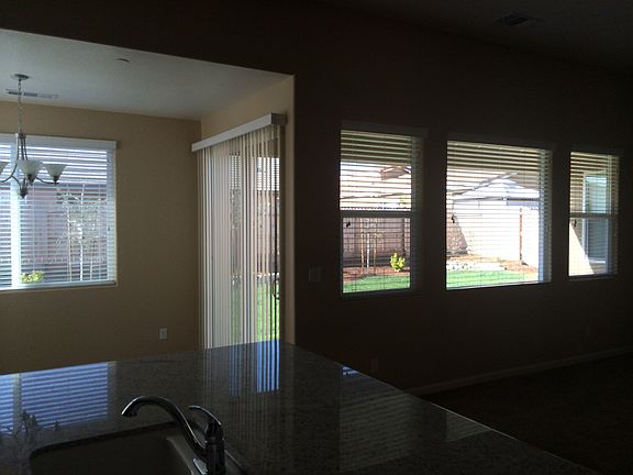 Looking from kitchen thru livingroom windows to backyard