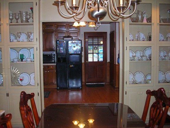 Informal dining with built-in-lighted cabinets