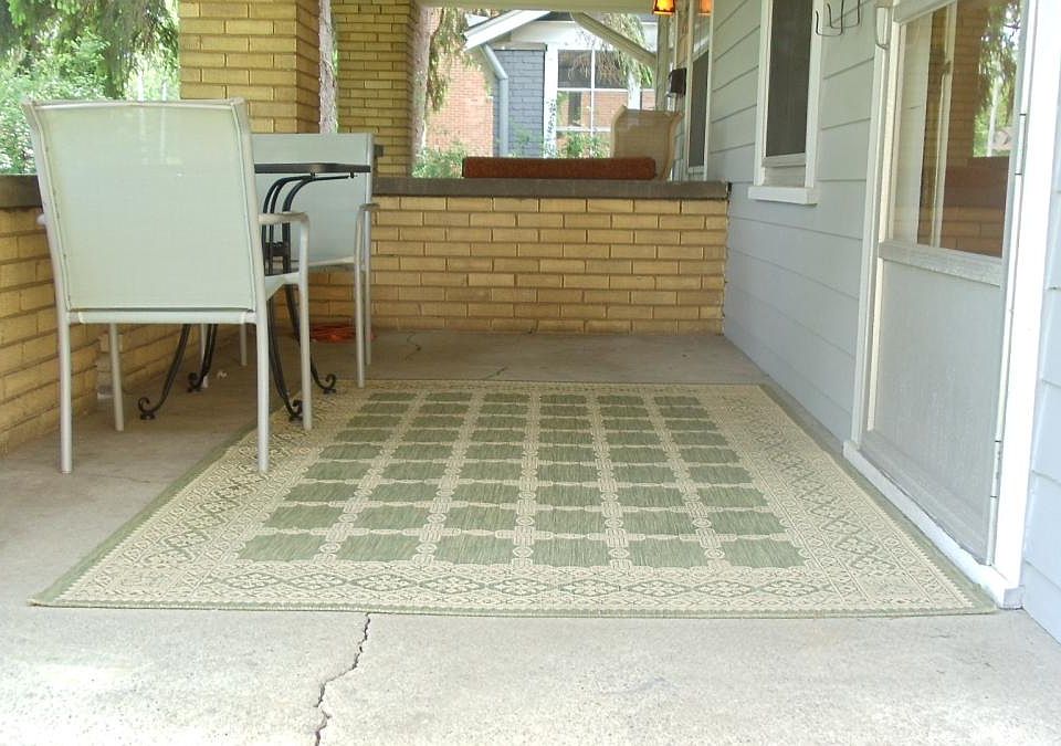 Front porch, large pine trees in yard provide privacy.