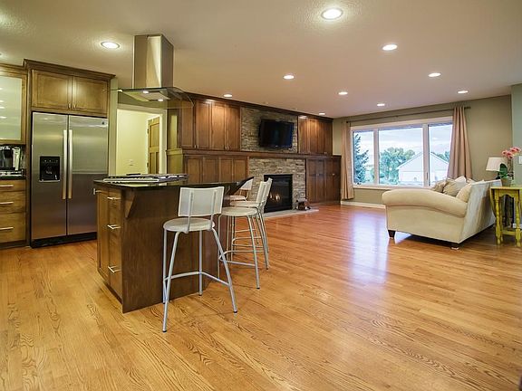Beautiful granite kitchen island with a charging station (6 outlets under the granite lip).