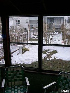 cute fenced backyard off screened porch