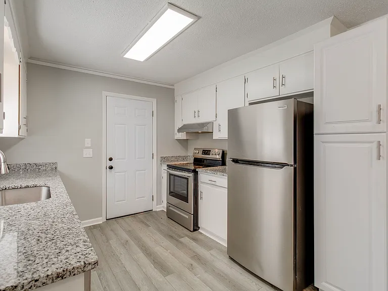 Kitchen with granite countertops and stainless steel appliances
