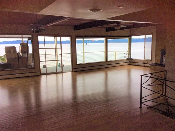 Living room hardwood floors, ceiling fan, sliding glass doors out to deck