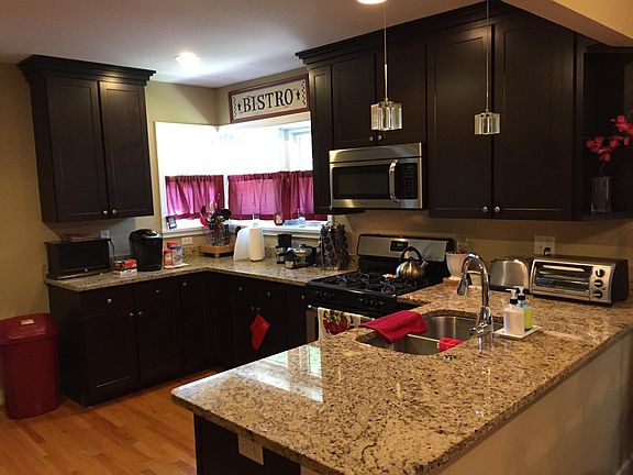 New Job Finished Hardwood Floors in Kitchen with espresso 42" cabinetry.