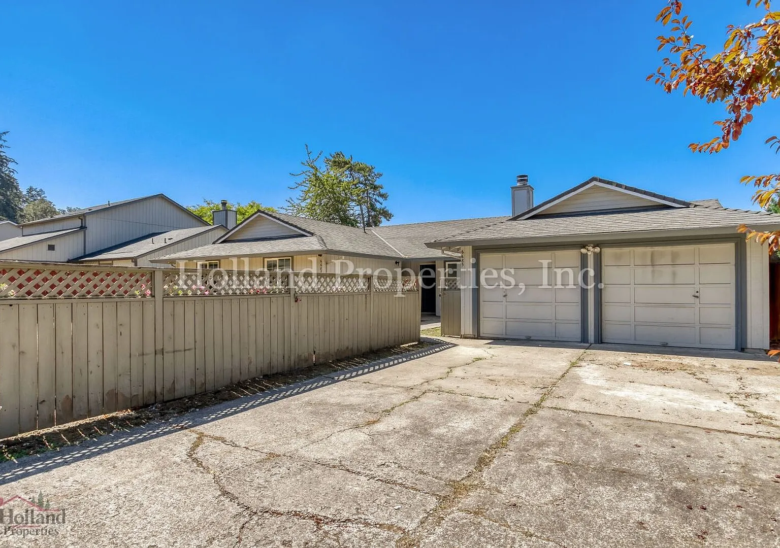 Charming Single-Level Duplex with Fireplace, Fenced Yard & Detached Garage — Photo 1