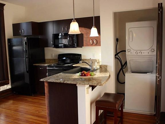 Apartment Sized Stacked Washer/Dryer and Breakfast Bar Facin