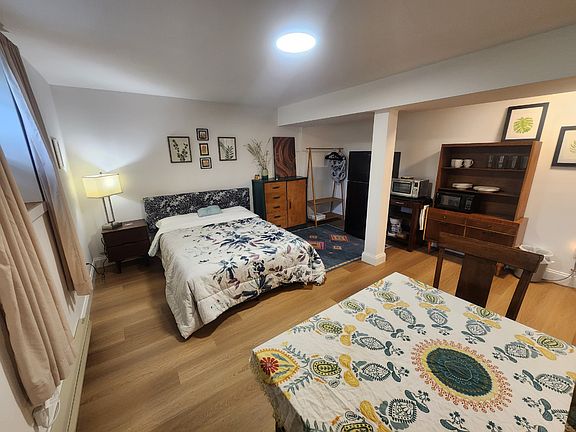 Double bed with night stand, dresser and a place to hang your clothing