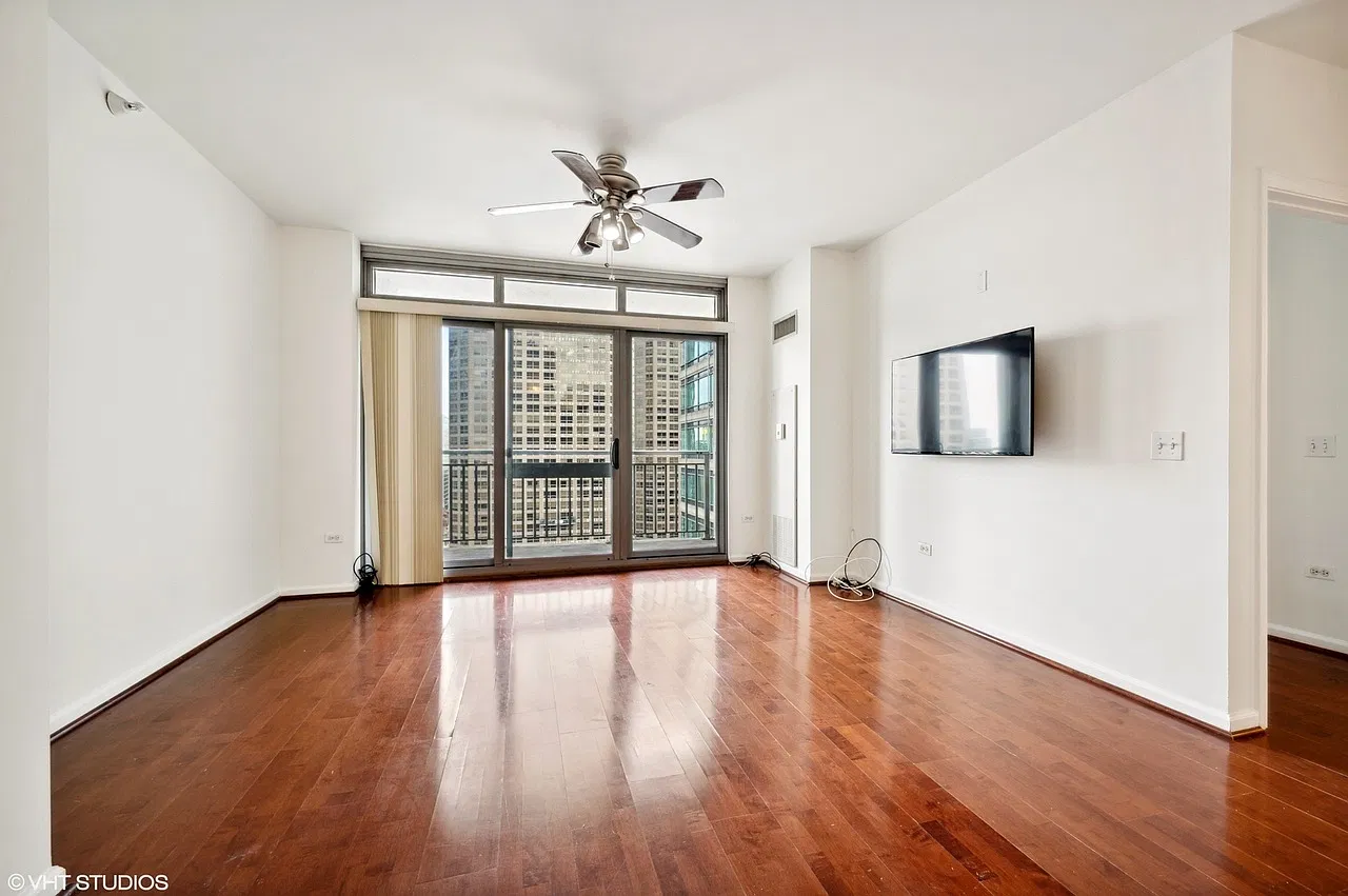 Hardwood floors, a ceiling fan and city views from the 17th floor
