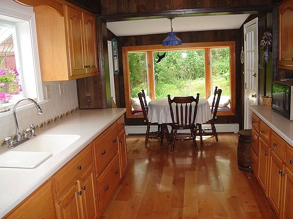 Eat In Kitchen Renovated in 2006 w/ Maple Cabinets & Floors, Corian Counter
