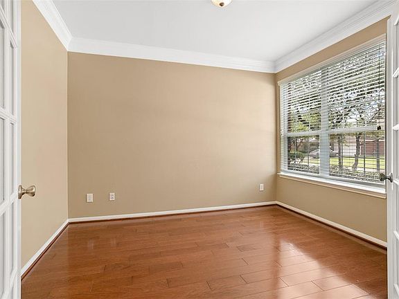 French doors leading into your study with crown molding.