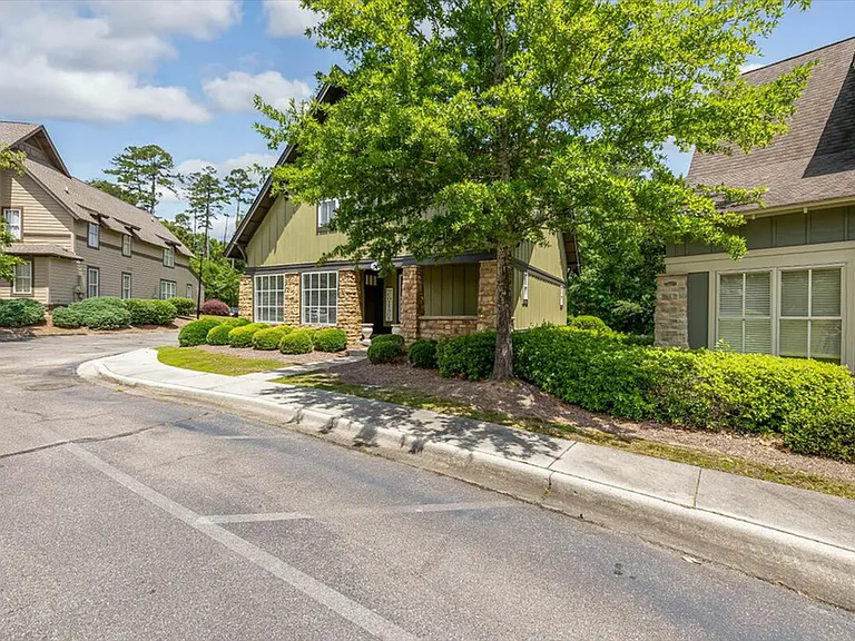 Charming, tree-lined community at The Cottages of Hattiesburg.