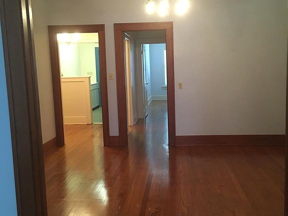 Dining room looking into breakfast room and down the hall to bedroom