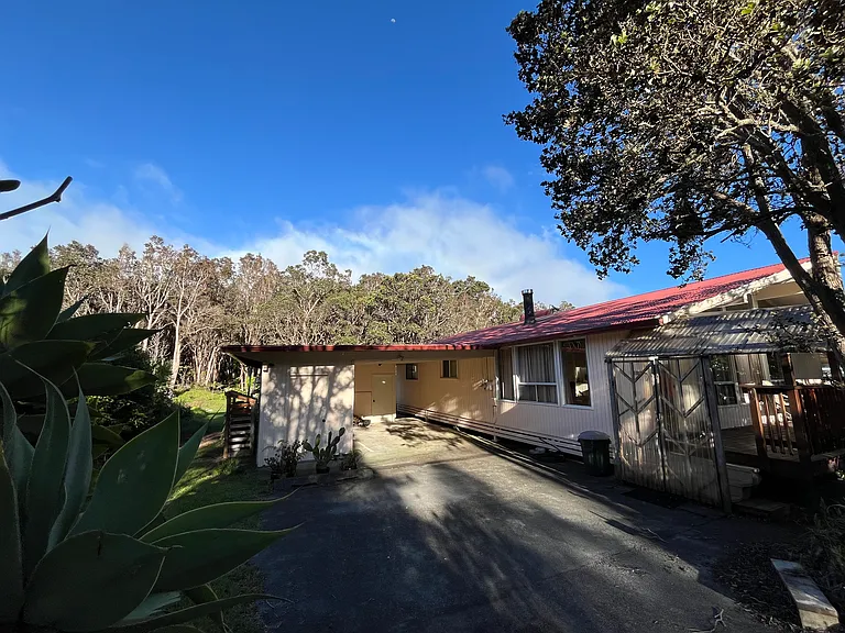 Front entrance off of carport. Three stairs up to front door. Tool shed to the left has garden equipment. Shed at the rear of carport has space for bikes and other outdoor equipment.