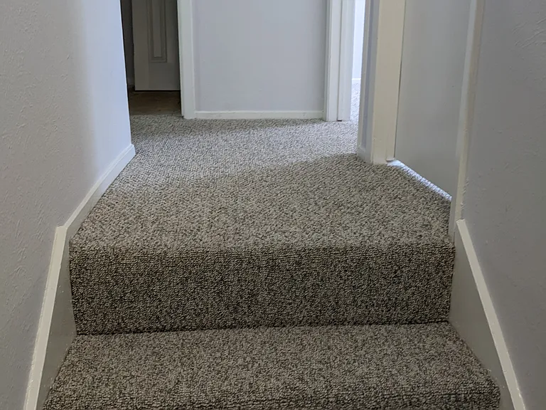 Top of stairway - bedrooms on right, master bedroom on left, hall bath straight.