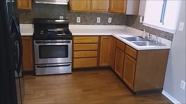 Gas stove and side-by-side refrigerator included.