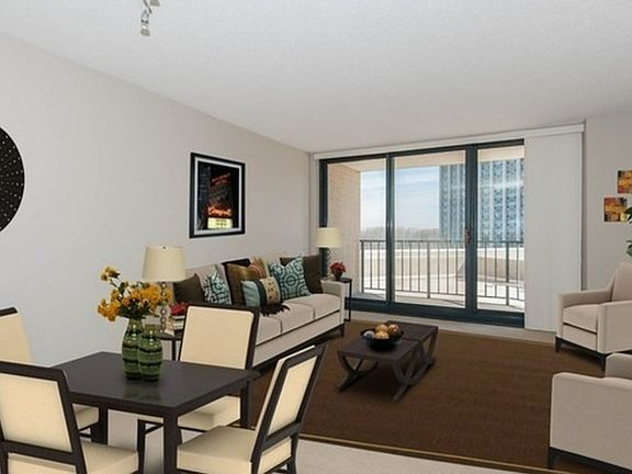 Living room lead to balcony with sliding door.