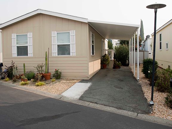 Front of house w carport
