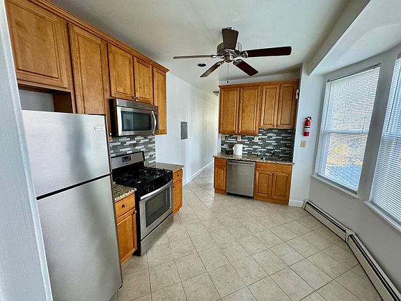 Kitchen w/maple wood cabinetry and ceramic tile flooring