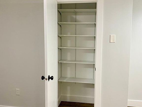 Ample closets with shelving throughout