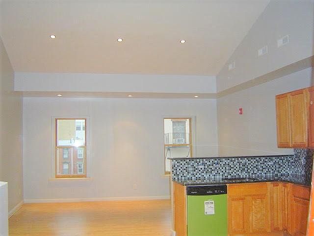 New Open Kitchen Overlooking Living Room with Cathedral Ceil