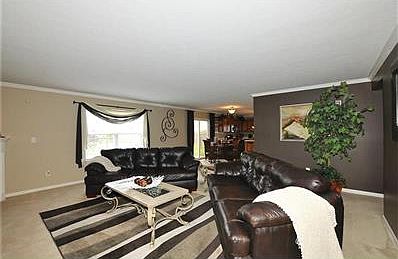 Large family room with gas log opens to the kitchen. Fresh paint, newer flooring.