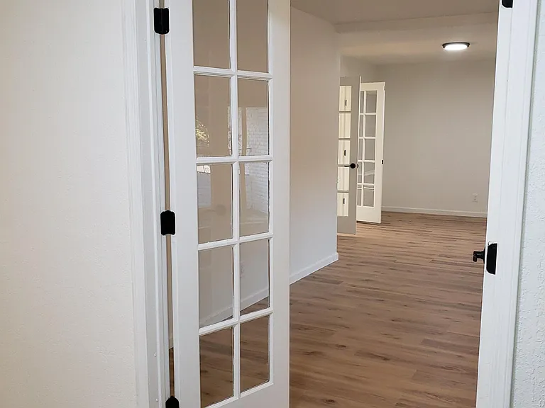French door entry to formal dining room, perspective from front door entry hall