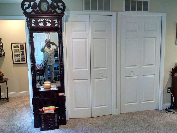 Bedroom with other closet doors