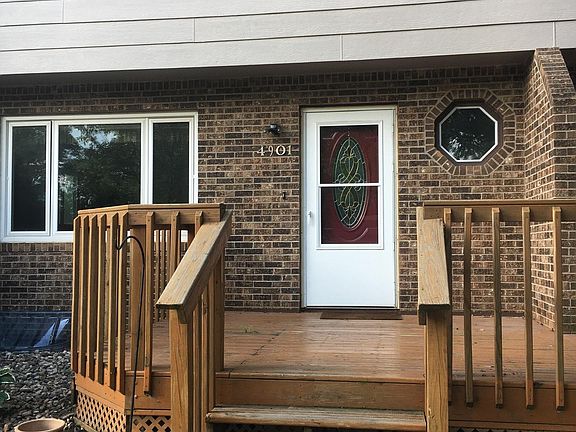 Welcoming front porch deck surrounded by gardens_an ideal spot for morning coffee, evening sunsets, or simply enjoying the serenity of your own outdoor retreat.