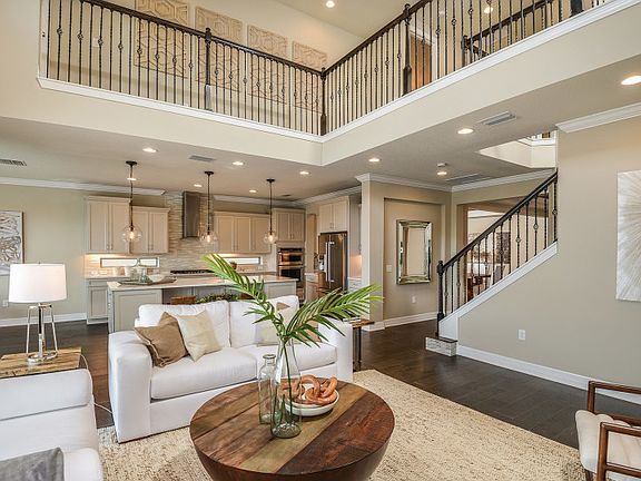 Model Representation 2-story gathering room concept open to the kitchen