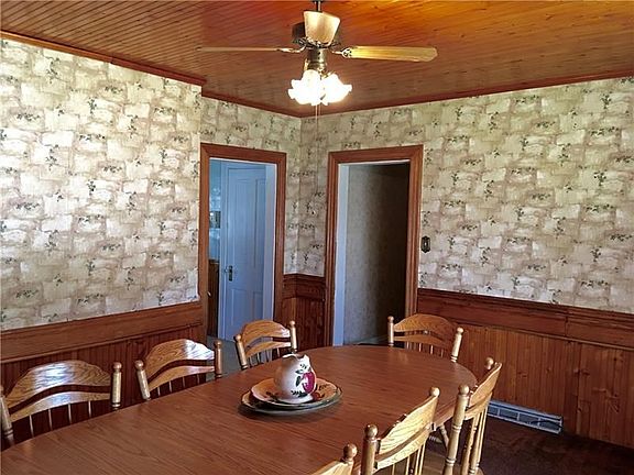 Dining Room with custom wood ceiling.