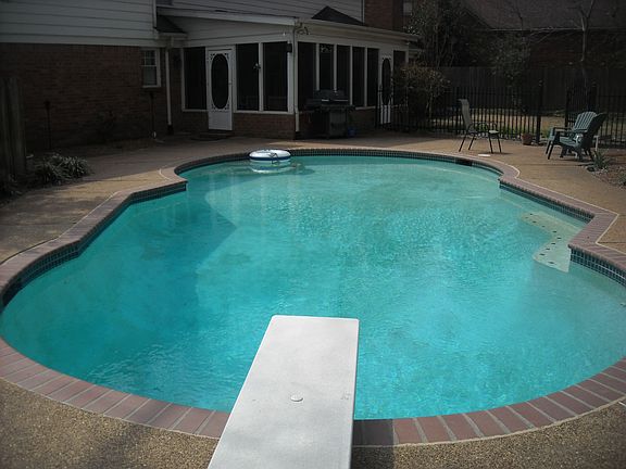 Spectacalar heated pool surrounded by professional landscaping.