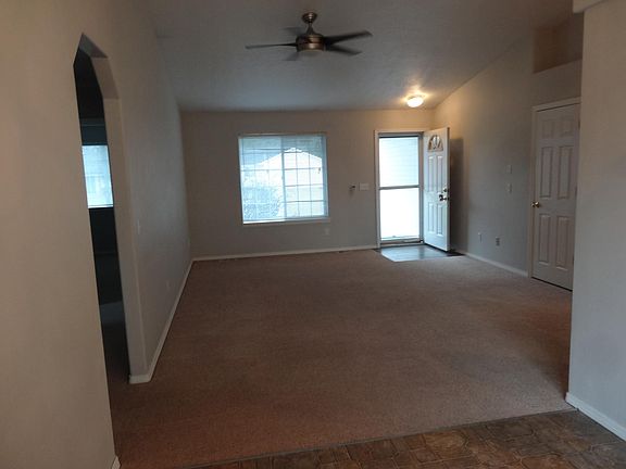 another view of living room to front door