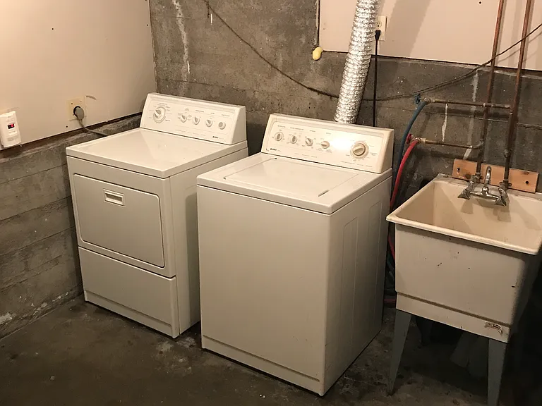 Basement laundry with farm sink