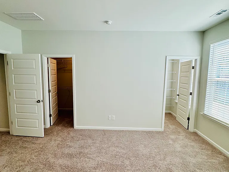 His Her closets view in Master Bed