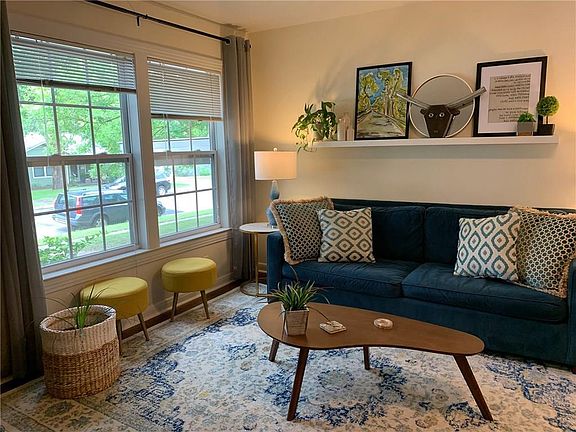 Large front windows fill the Living Room with natural light.